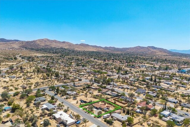7638 Dumosa Ave, Yucca Valley, CA 92284 - drone / aerial view of a mountain backdrop and a desert landscape