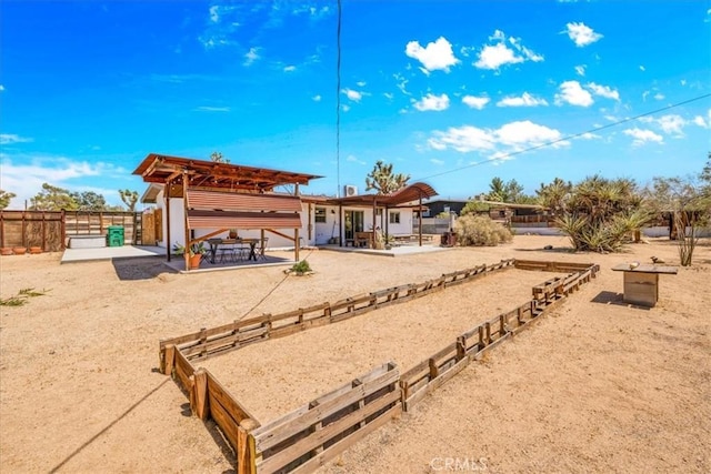 7638 Dumosa Ave, Yucca Valley, CA 92284 - rear view of house featuring a patio