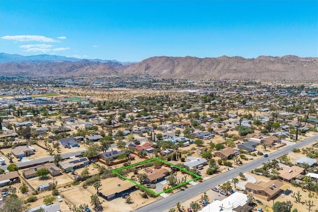 7638 Dumosa Ave, Yucca Valley, CA 92284 - aerial perspective of suburban area with mountains and property boundaries highlighted