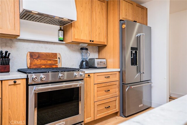 9140 Garden St, Rancho Cucamonga, CA 91701 - kitchen featuring appliances with stainless steel finishes, custom exhaust hood, light countertops, and decorative backsplash