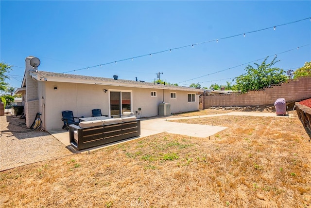 9140 Garden St, Rancho Cucamonga, CA 91701 - rear view of house with a fenced backyard, a patio, outdoor lounge area, and stucco siding