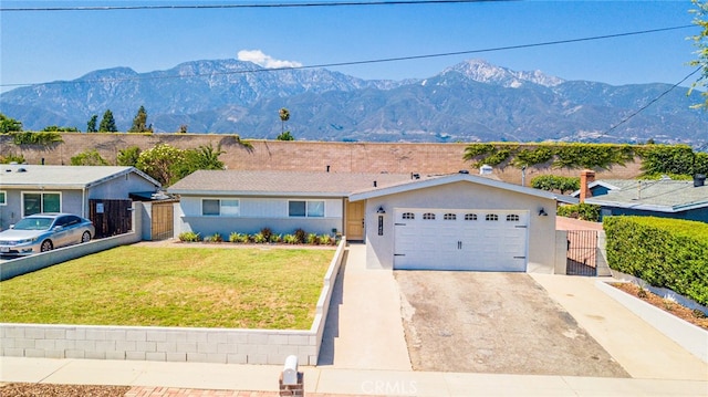 9140 Garden St, Rancho Cucamonga, CA 91701 - view of front of house with a mountain view, driveway, a gate, and stucco siding