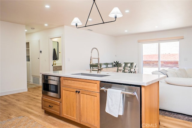 9140 Garden St, Rancho Cucamonga, CA 91701 - kitchen with dishwasher, open floor plan, light wood-type flooring, light countertops, and recessed lighting