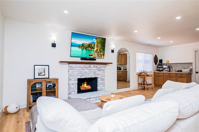 9140 Garden St, Rancho Cucamonga, CA 91701 - living room featuring light wood finished floors, recessed lighting, and a fireplace
