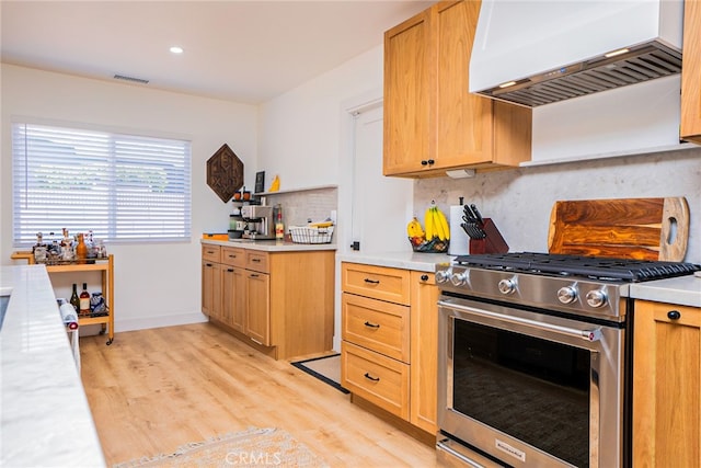 9140 Garden St, Rancho Cucamonga, CA 91701 - kitchen featuring gas stove, custom exhaust hood, light wood-type flooring, light countertops, and recessed lighting