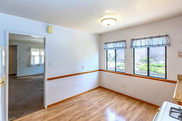 14836 Rayfield Dr, La Mirada, CA 90638 - empty room with healthy amount of natural light and light wood-style flooring