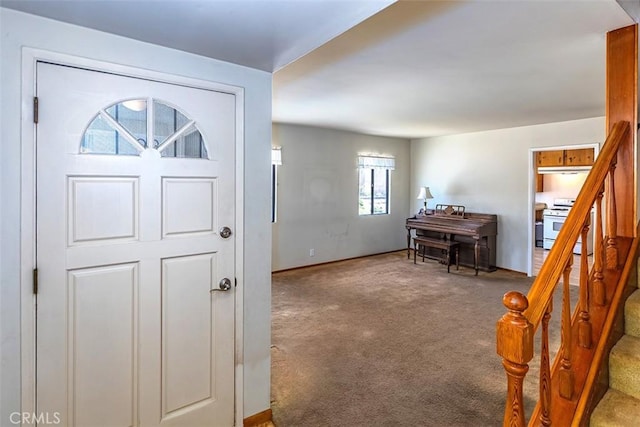 14836 Rayfield Dr, La Mirada, CA 90638 - carpeted foyer entrance featuring stairway and baseboards