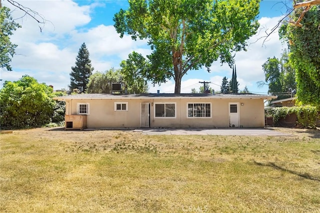 2344 Porter Way, Chico, CA 95926 - rear view of property featuring a lawn, a patio area, and stucco siding