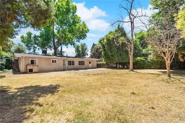 2344 Porter Way, Chico, CA 95926 - back of house featuring a yard, a patio area, and stucco siding