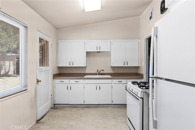 2344 Porter Way, Chico, CA 95926 - kitchen featuring white appliances, vaulted ceiling, white cabinetry, and dark countertops