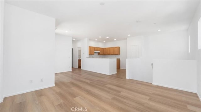 10375 Church St Unit 74, Rancho Cucamonga, CA 91730 - unfurnished living room with light wood finished floors and recessed lighting