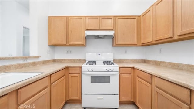 10375 Church St Unit 74, Rancho Cucamonga, CA 91730 - kitchen featuring white range with gas stovetop, range hood, light countertops, and light brown cabinetry