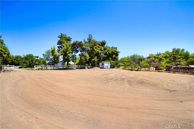 17321 Sunset View Dr, Riverside, CA 92504 - view of yard with a storage unit and an outdoor riding arena