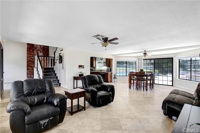 17321 Sunset View Dr, Riverside, CA 92504 - living room featuring plenty of natural light, ceiling fan, stairway, and light tile patterned flooring