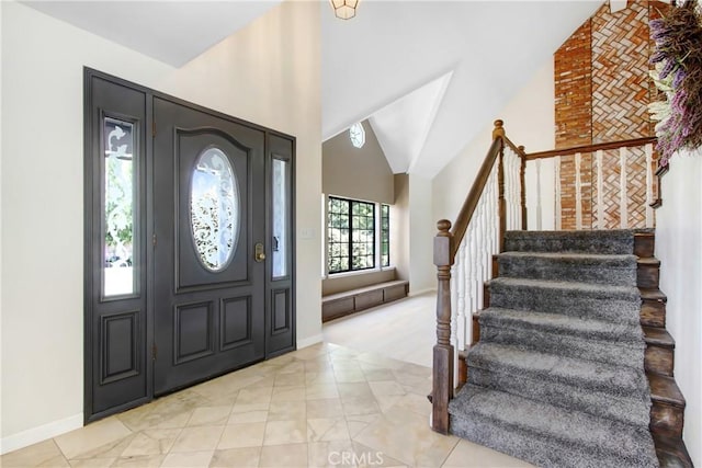 17321 Sunset View Dr, Riverside, CA 92504 - entryway with stairway, high vaulted ceiling, and light colored carpet