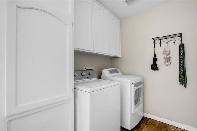 17321 Sunset View Dr, Riverside, CA 92504 - laundry area featuring cabinet space, washing machine and clothes dryer, and dark wood-style flooring