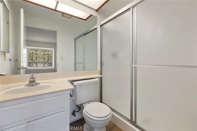 7038 De Celis Pl Unit 4, Van Nuys, CA 91406 - bathroom with a shower stall, vanity, and wood finished floors