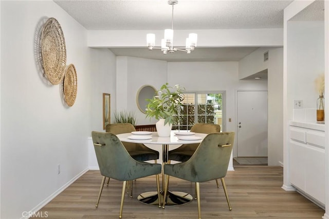 7038 De Celis Pl Unit 4, Van Nuys, CA 91406 - dining space with a chandelier and light wood-style floors