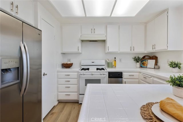7038 De Celis Pl Unit 4, Van Nuys, CA 91406 - kitchen with stainless steel refrigerator with ice dispenser, white gas range, under cabinet range hood, light wood-type flooring, and white cabinetry