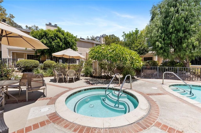7038 De Celis Pl Unit 4, Van Nuys, CA 91406 - view of pool with a community hot tub, a patio, and a pool