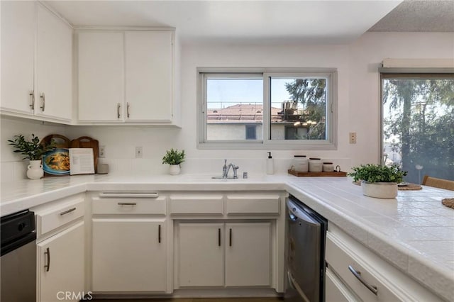 7038 De Celis Pl Unit 4, Van Nuys, CA 91406 - kitchen with dishwasher, healthy amount of natural light, and white cabinetry
