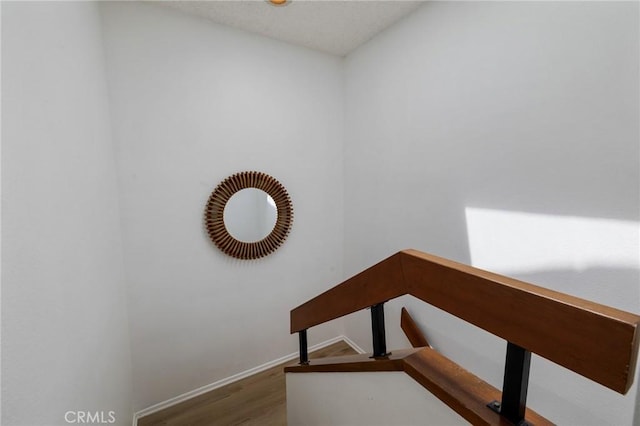 7038 De Celis Pl Unit 4, Van Nuys, CA 91406 - stairs with wood finished floors and baseboards