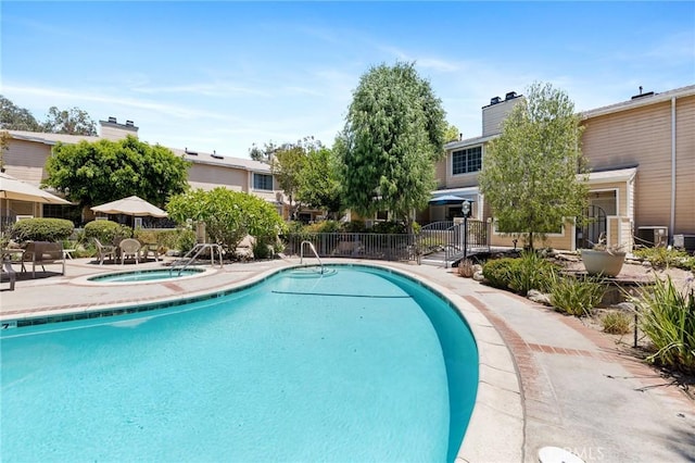 7038 De Celis Pl Unit 4, Van Nuys, CA 91406 - community pool featuring a hot tub and a patio area