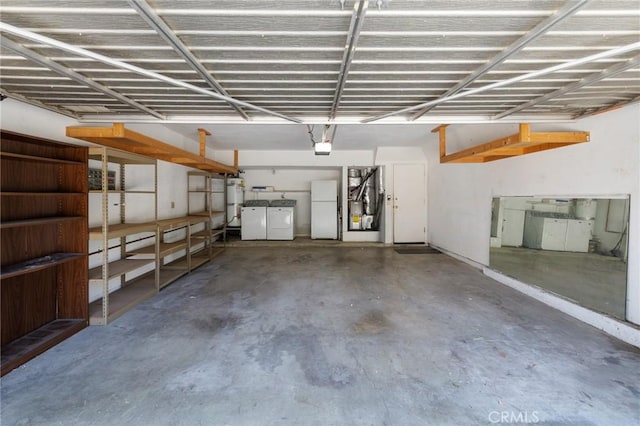 7038 De Celis Pl Unit 4, Van Nuys, CA 91406 - garage with freestanding refrigerator, washing machine and dryer, water heater, and a garage door opener