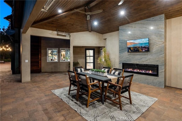 19022 Shamrock Ln, Yorba Linda, CA 92886 - dining room featuring high vaulted ceiling, stone tile floors, a fireplace, a ceiling fan, and wooden ceiling