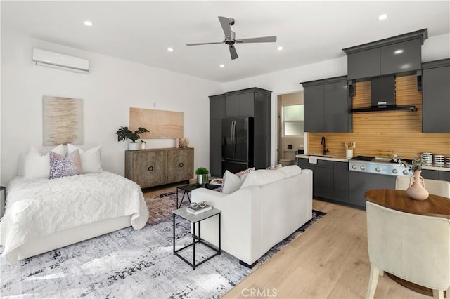 19022 Shamrock Ln, Yorba Linda, CA 92886 - bedroom with freestanding refrigerator, a wall mounted air conditioner, light wood-type flooring, recessed lighting, and ceiling fan