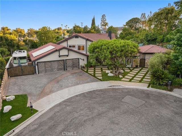 19022 Shamrock Ln, Yorba Linda, CA 92886 - view of front of property featuring a gate, driveway, and solar panels