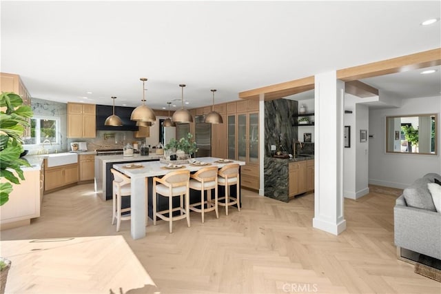 19022 Shamrock Ln, Yorba Linda, CA 92886 - kitchen with a spacious island, recessed lighting, light brown cabinetry, light countertops, and decorative backsplash