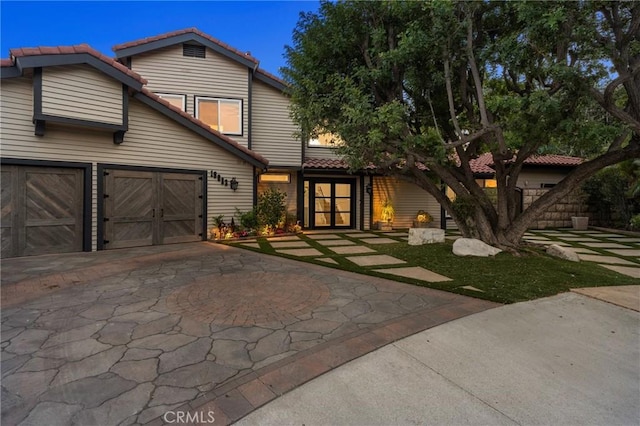 19022 Shamrock Ln, Yorba Linda, CA 92886 - view of front of home featuring driveway, a tiled roof, a garage, and french doors