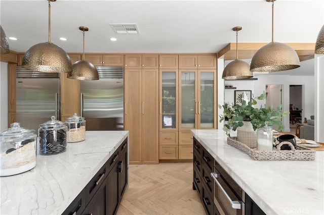 19022 Shamrock Ln, Yorba Linda, CA 92886 - kitchen featuring built in refrigerator, glass insert cabinets, pendant lighting, light stone countertops, and recessed lighting