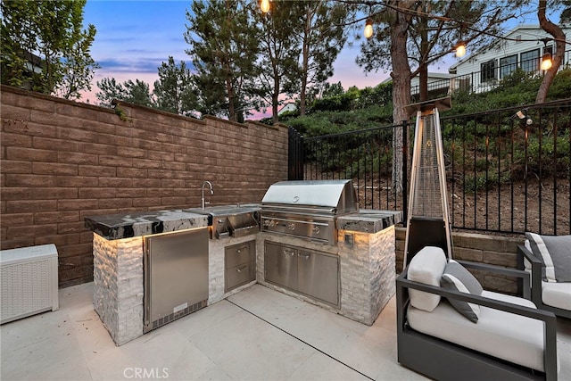 20 Becker, Ladera Ranch, CA 92694 - patio terrace at dusk with exterior kitchen and a patio