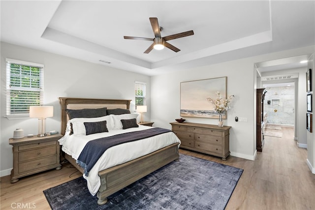 20 Becker, Ladera Ranch, CA 92694 - bedroom featuring a tray ceiling, light wood-style floors, and a ceiling fan