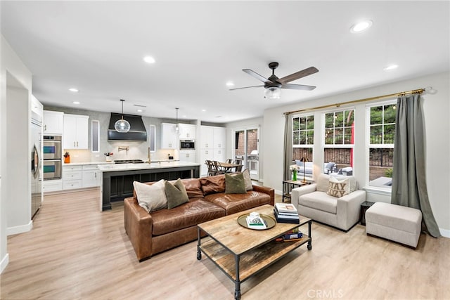 20 Becker, Ladera Ranch, CA 92694 - living area featuring light wood finished floors, recessed lighting, and a ceiling fan