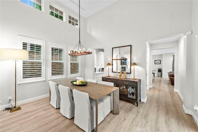 20 Becker, Ladera Ranch, CA 92694 - dining area featuring a high ceiling, light wood-style flooring, and a chandelier
