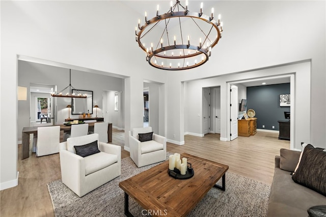 20 Becker, Ladera Ranch, CA 92694 - living area featuring a chandelier, light wood finished floors, and a high ceiling