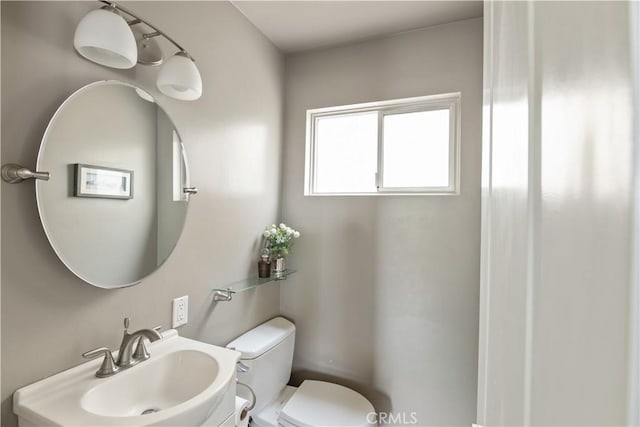 284 Chiquita St, Laguna Beach, CA 92651 - half bathroom featuring a sink and toilet