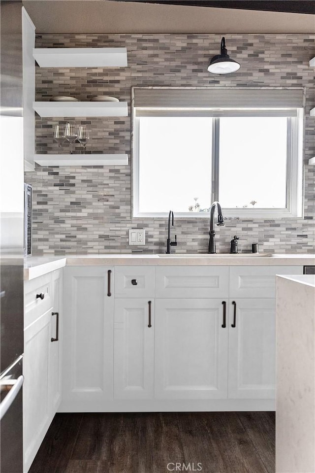 284 Chiquita St, Laguna Beach, CA 92651 - kitchen featuring white cabinetry, dark wood finished floors, tasteful backsplash, and light countertops