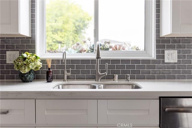 284 Chiquita St, Laguna Beach, CA 92651 - kitchen featuring white cabinetry, dishwasher, light countertops, and backsplash