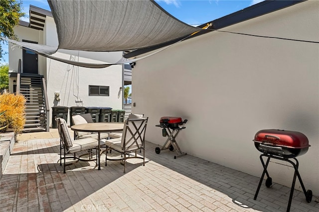 284 Chiquita St, Laguna Beach, CA 92651 - view of patio with stairs, outdoor dining space, and a grill