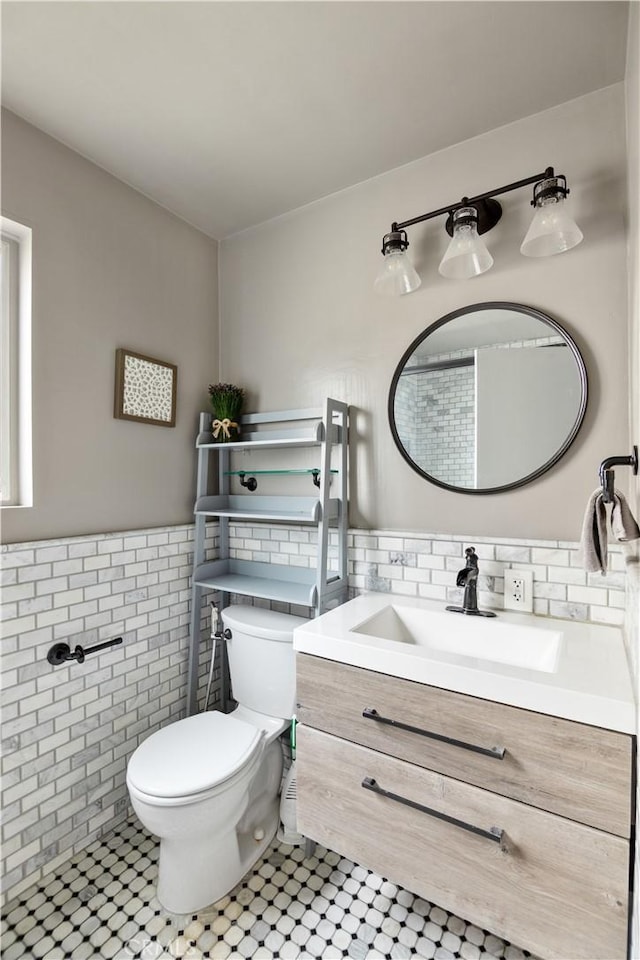 284 Chiquita St, Laguna Beach, CA 92651 - bathroom with tile walls, vanity, tile patterned flooring, and a wainscoted wall