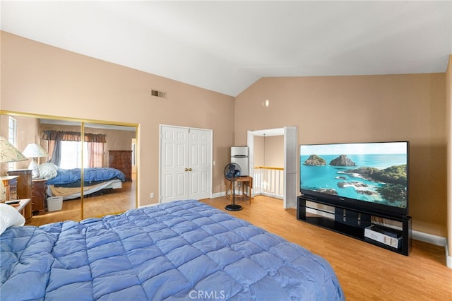 6791 Florence Pl, Rancho Cucamonga, CA 91701 - bedroom with multiple closets, high vaulted ceiling, and wood finished floors