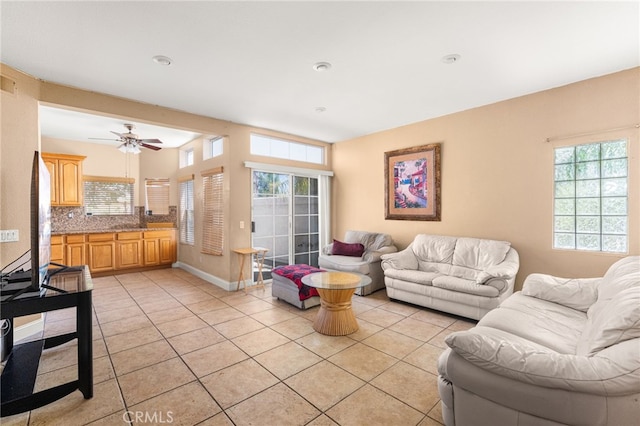 6791 Florence Pl, Rancho Cucamonga, CA 91701 - living room with light tile patterned floors, healthy amount of natural light, and a ceiling fan