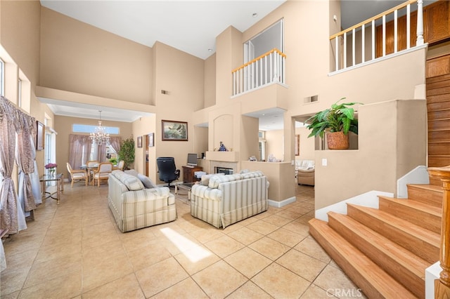 6791 Florence Pl, Rancho Cucamonga, CA 91701 - living room featuring a chandelier, light tile patterned floors, a high ceiling, stairway, and a fireplace
