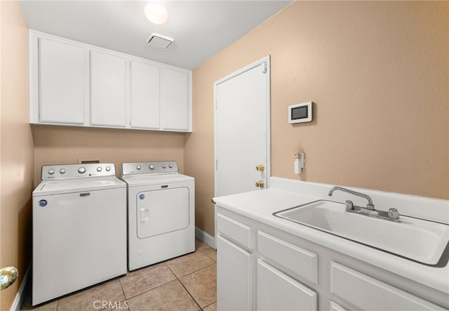 6791 Florence Pl, Rancho Cucamonga, CA 91701 - washroom featuring cabinet space, washer and clothes dryer, and light tile patterned floors