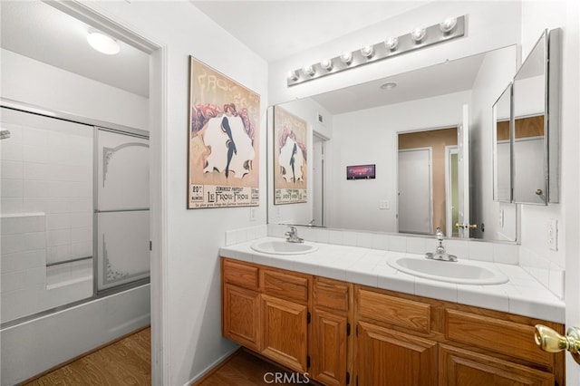 6791 Florence Pl, Rancho Cucamonga, CA 91701 - bathroom with double vanity,  shower combination, and wood finished floors