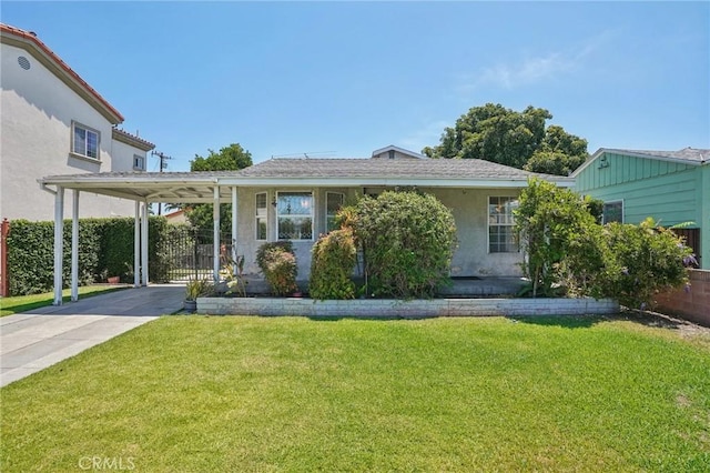 10018 San Vincente Ave, South Gate, CA 90280 - view of front of home with an attached carport, concrete driveway, and stucco siding